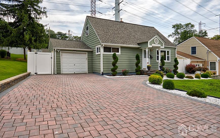 10 Pennington Road New Brunswick, NJ 08901 - Photo 3 of 29 a front view of a house with a yard and trees
