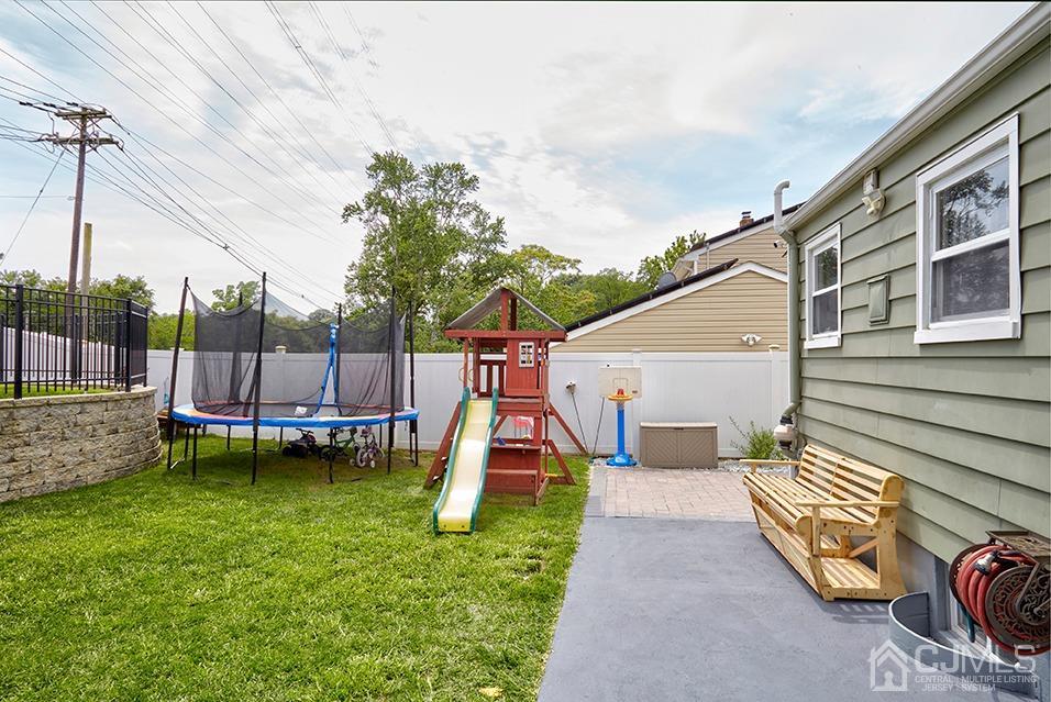 10 Pennington Road New Brunswick, NJ 08901 - Photo 26 of 29 a view of a house with a backyard and a table