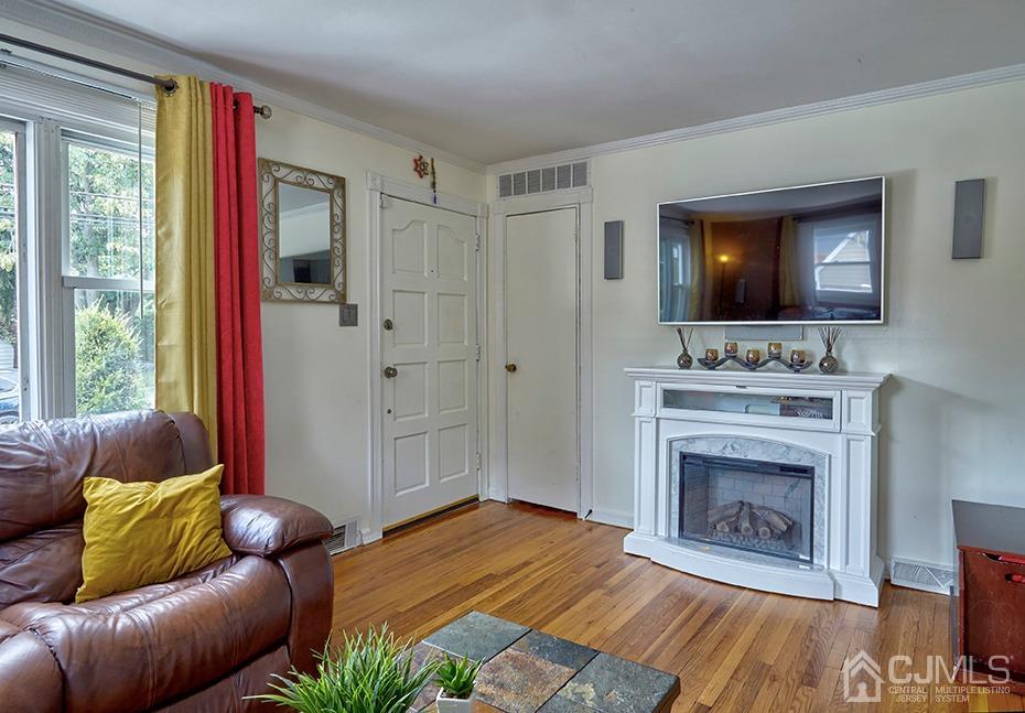 10 Pennington Road New Brunswick, NJ 08901 - Photo 5 of 29 a living room with furniture and a fireplace