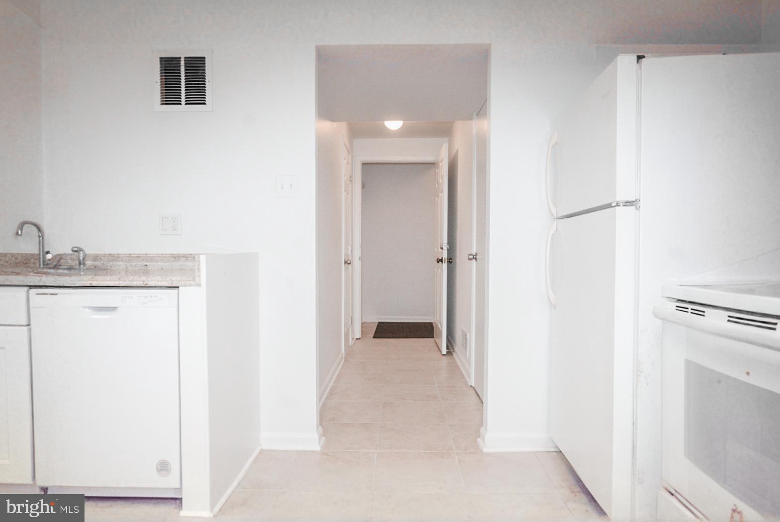 3104 Benton Square Drive Olney, MD 20832 - Photo 7 of 11 a view of a hallway with closet and wooden floor