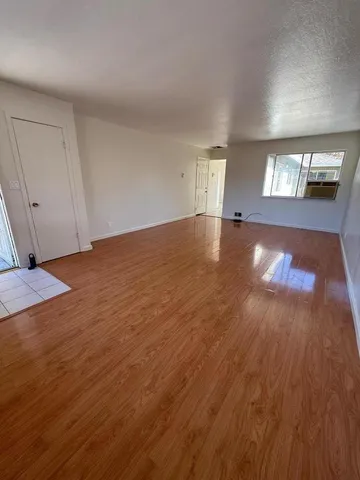 a view of a livingroom with wooden floor
