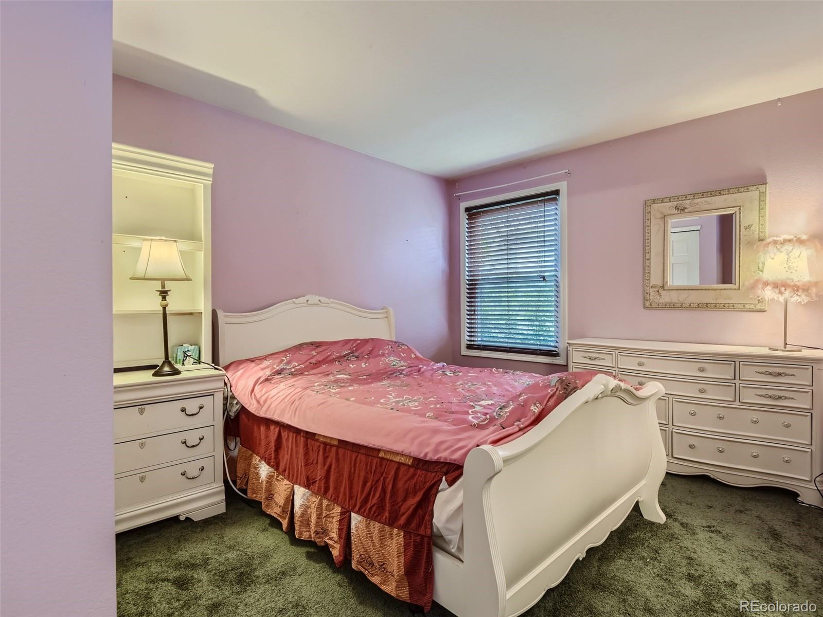 6722 Eagle Place Highlands Ranch, CO 80130 - Photo 11 of 34 a bedroom with a bed and a window