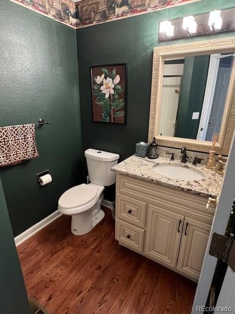 6722 Eagle Place Highlands Ranch, CO 80130 - Photo 21 of 34 a bathroom with a granite countertop toilet sink and mirror
