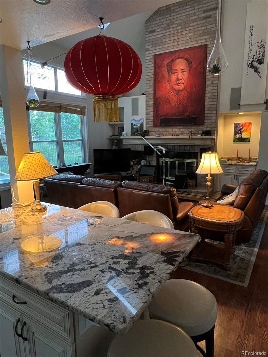 6722 Eagle Place Highlands Ranch, CO 80130 - Photo 22 of 34 a room with furniture and flat screen tv