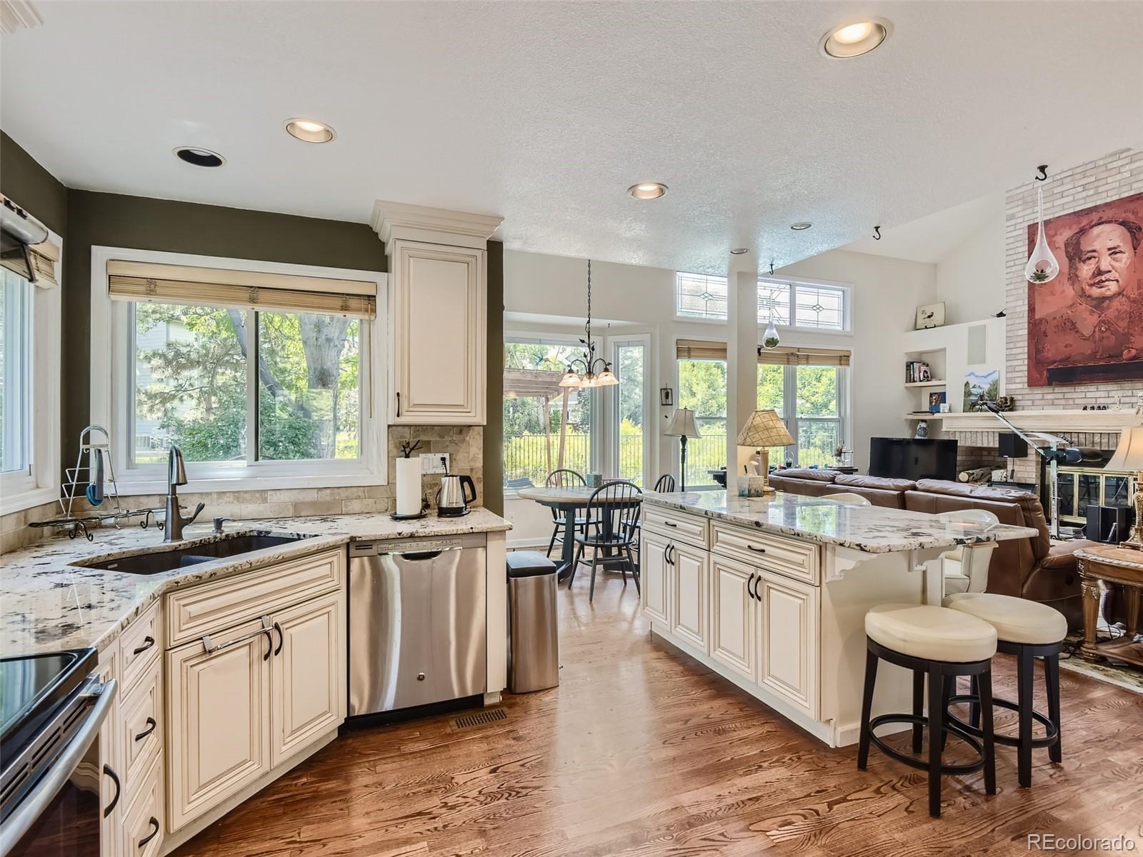 6722 Eagle Place Highlands Ranch, CO 80130 - Photo 4 of 34 a kitchen with lots of counter top space and dining table