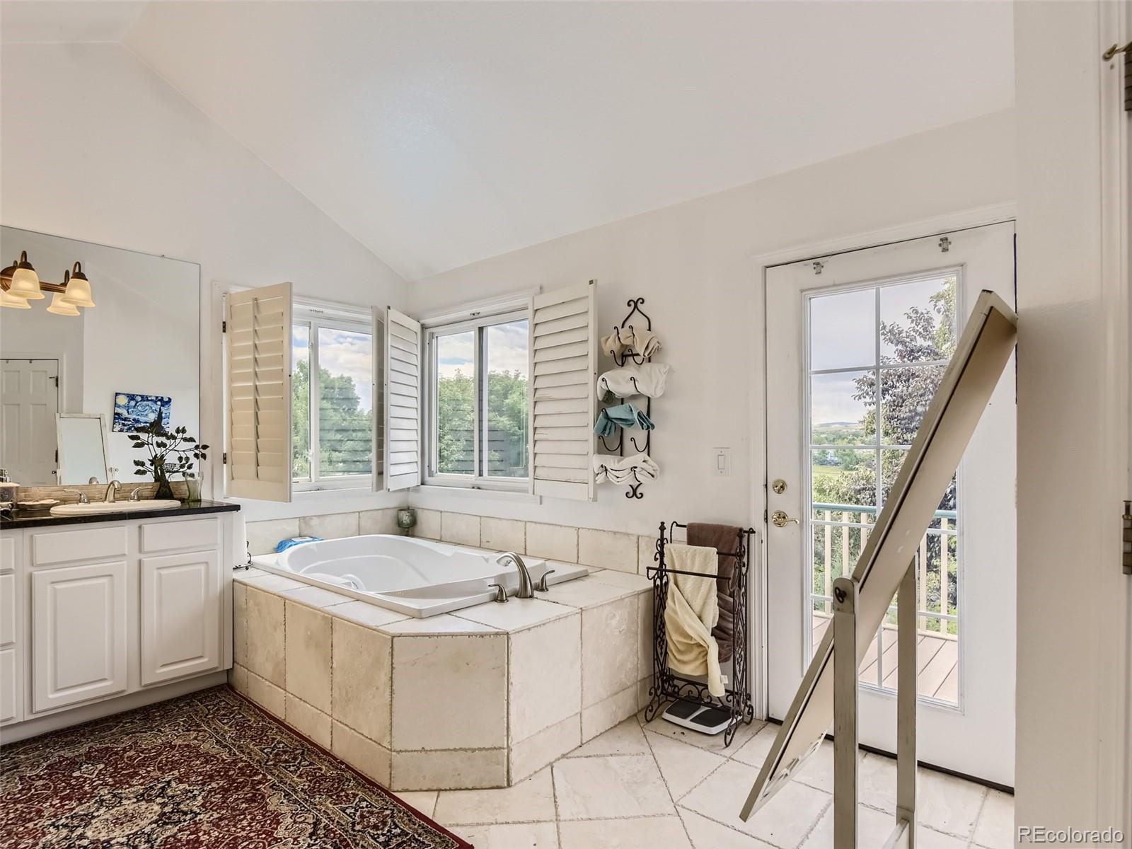 6722 Eagle Place Highlands Ranch, CO 80130 - Photo 8 of 34 a spacious bathroom with sink and mirror