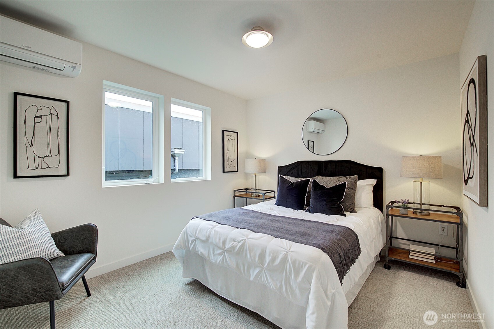 7341 California Avenue Southwest Seattle, WA 98136 - Photo 29 of 38 a bedroom with a bed and chair