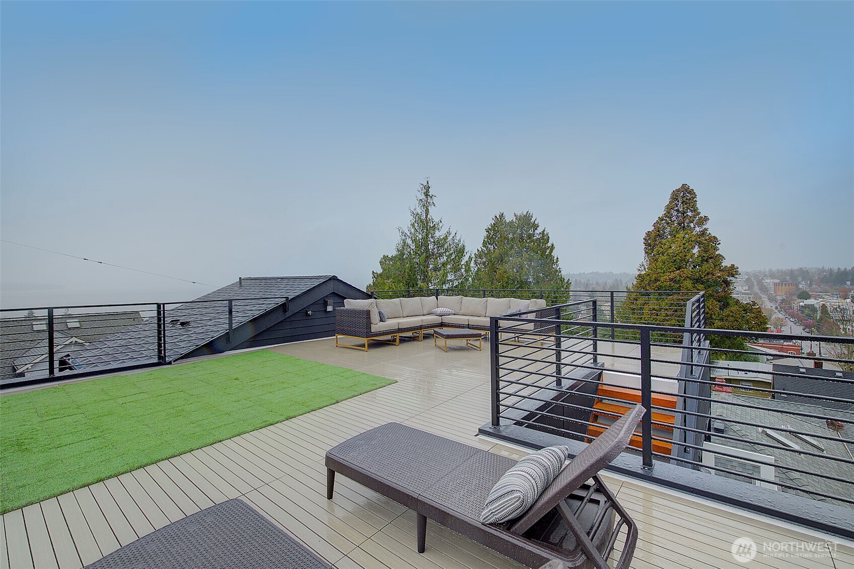 7341 California Avenue Southwest Seattle, WA 98136 - Photo 34 of 38 a view of a terrace with wooden floor and fence