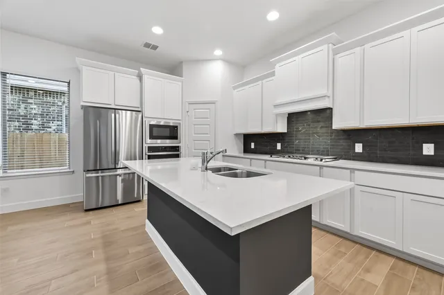 a bathroom with a sink vanity and a mirror