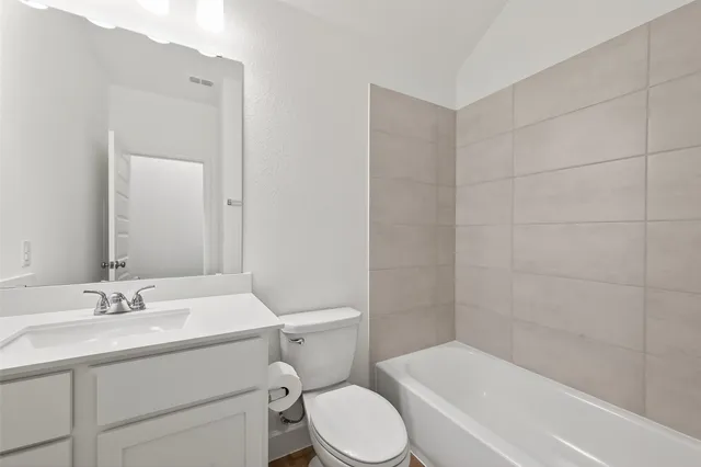 a bathroom with a double vanity sink mirror and shower
