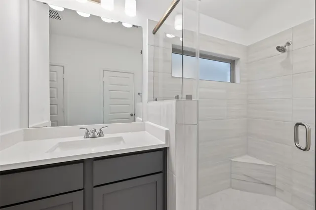 a view of a house with yard and a garden