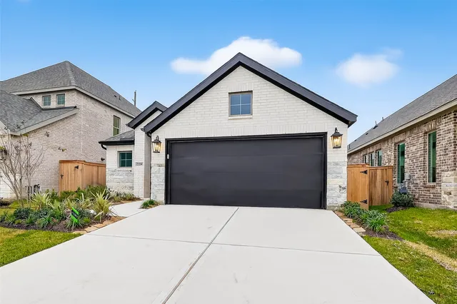 a front view of house with garage and yard
