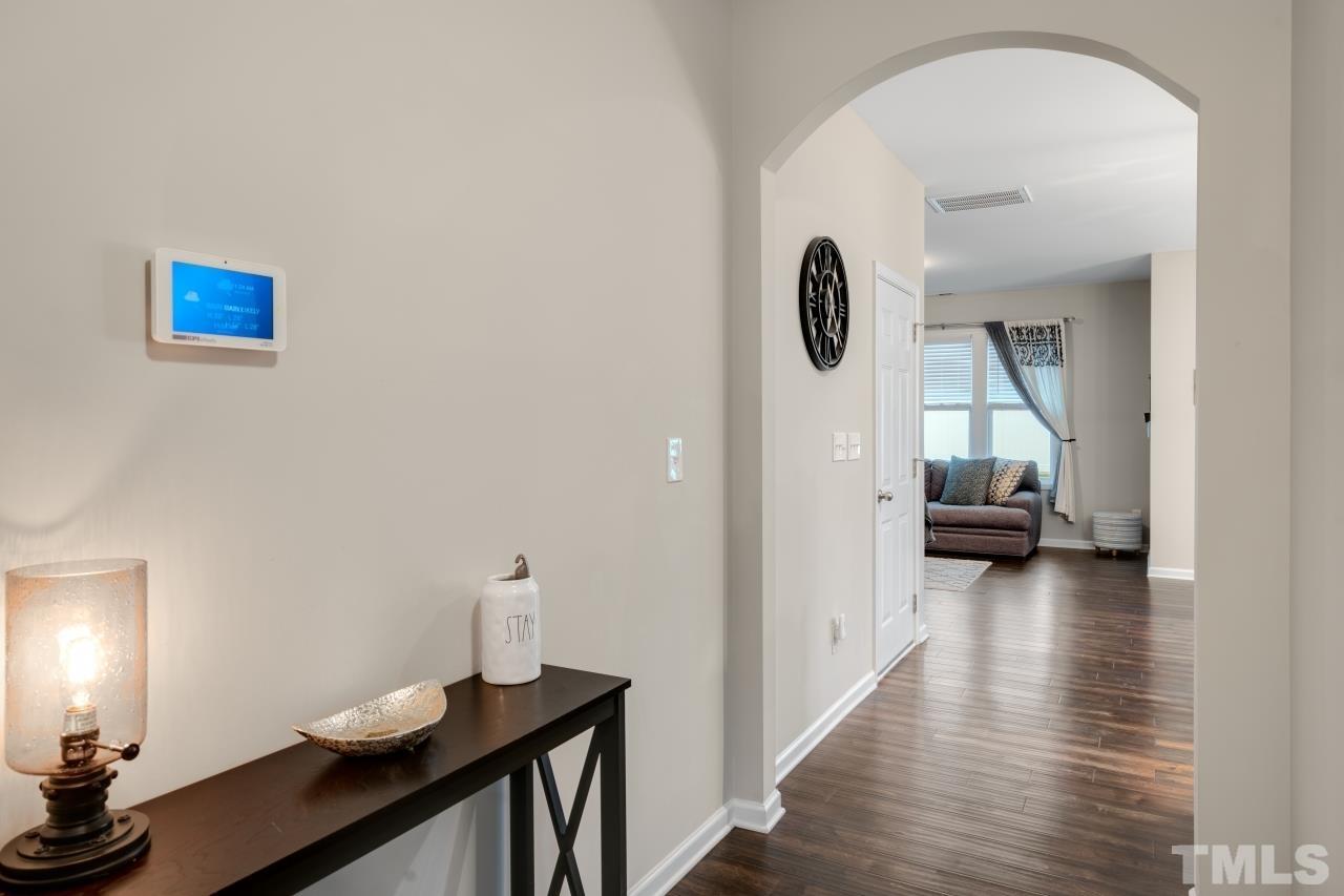 285 Bella Square Smithfield, NC 27577 - Photo 14 of 30 a view of a hallway that has hardwood floor and furniture