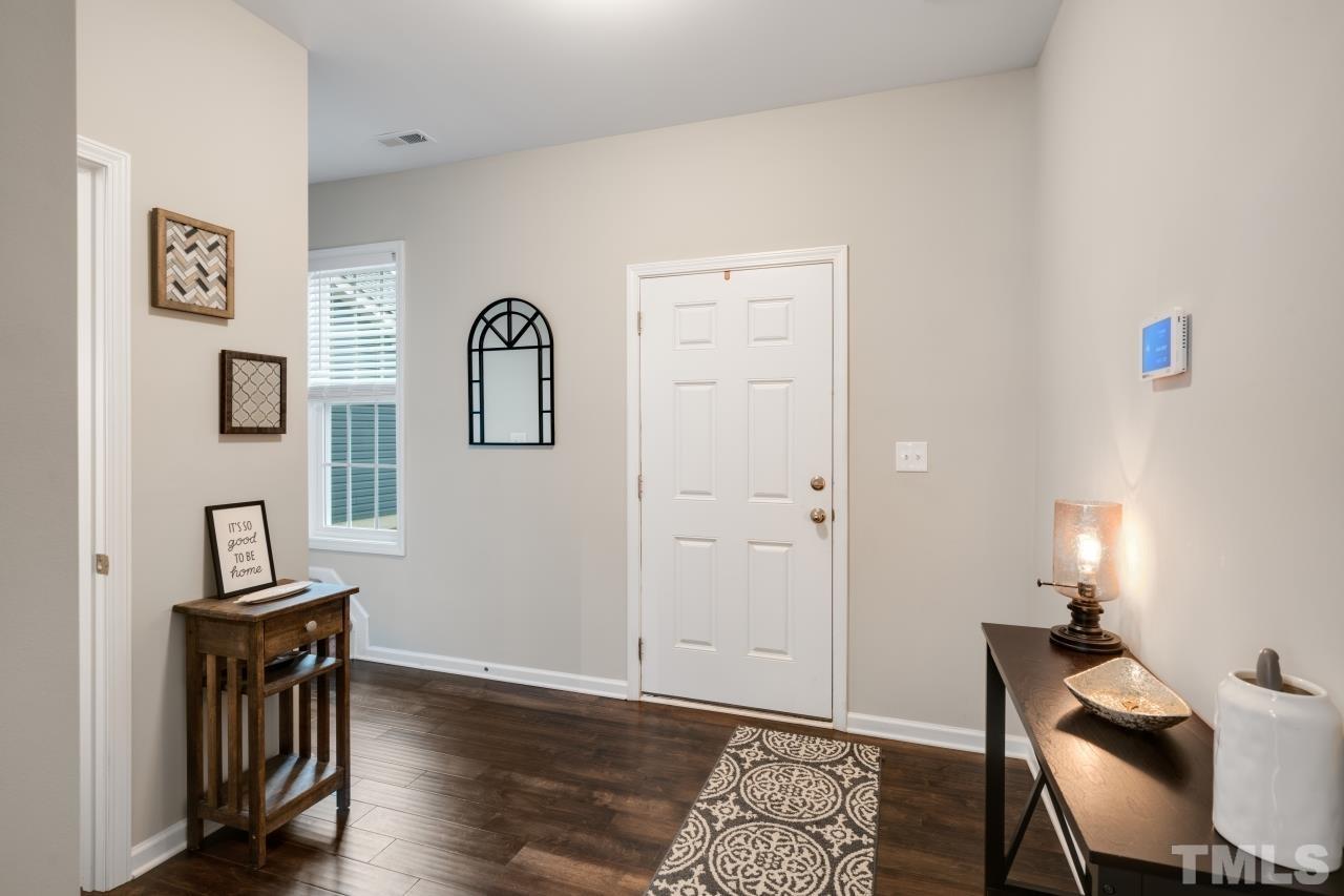 285 Bella Square Smithfield, NC 27577 - Photo 15 of 30 a view of a livingroom with furniture and wooden floor