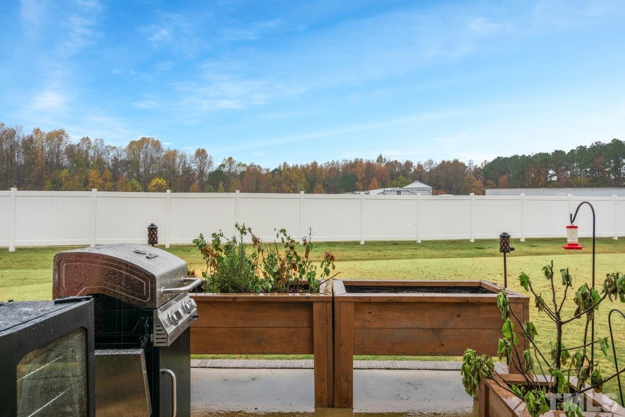285 Bella Square Smithfield, NC 27577 - Photo 27 of 30 a view of a lake with table and chairs