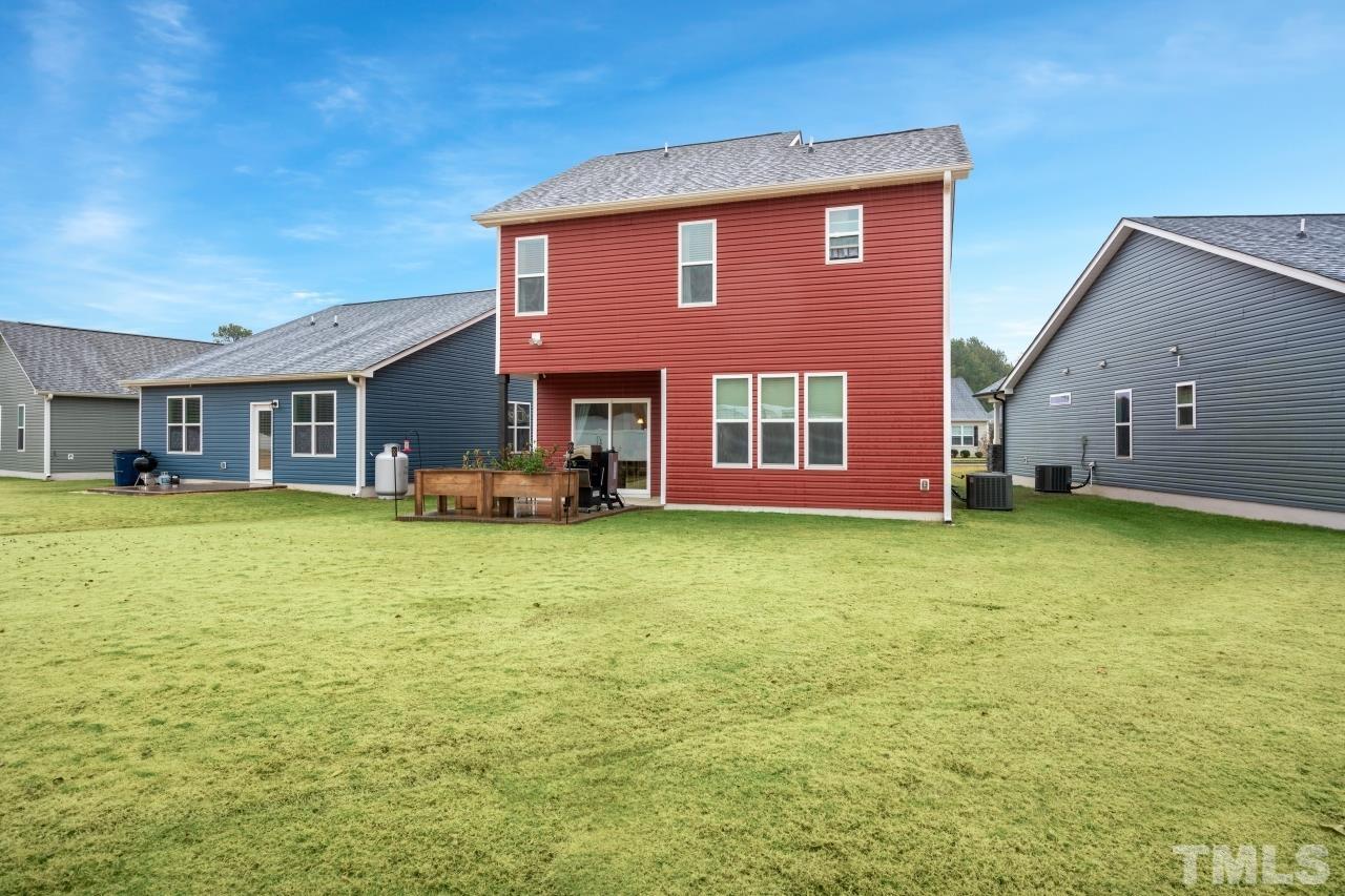 285 Bella Square Smithfield, NC 27577 - Photo 29 of 30 a front view of a house with a garden
