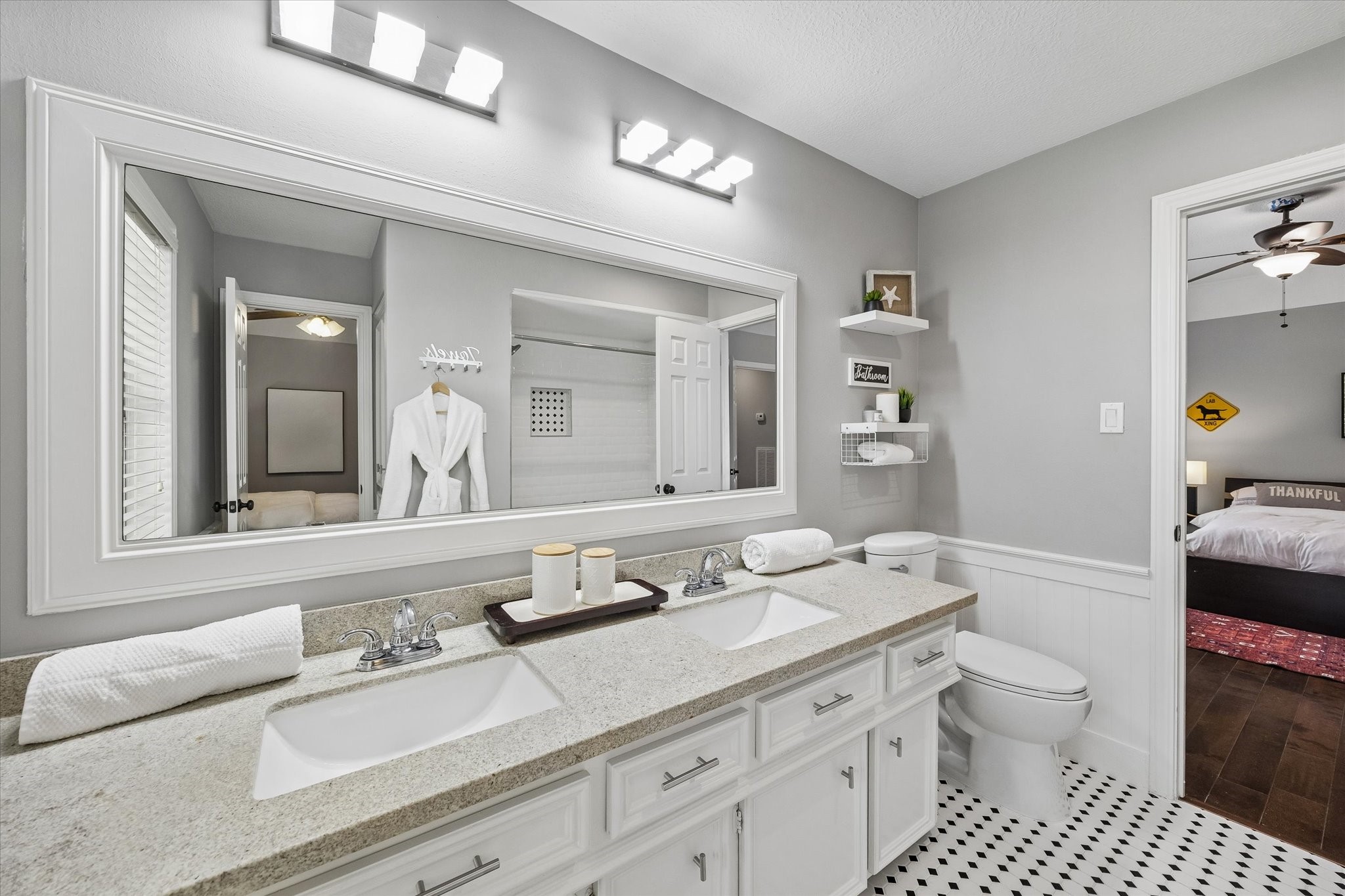 146 Golden Shadow Circle Spring, TX 77381 - Photo 30 of 41 The upstairs secondary bedroom’s Jack and Jill bath features double sinks, generous countertop space, and abundant storage, combining comfort and functionality with a bright, polished design.
