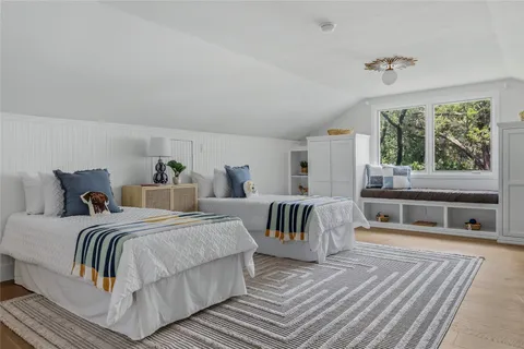a bedroom with a bed and a couch