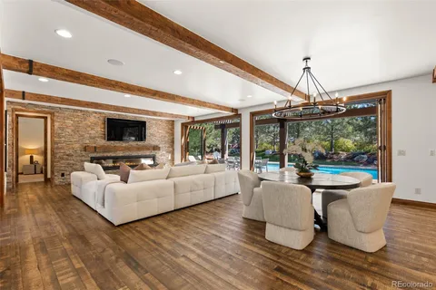 a living room with fireplace furniture and a flat screen tv