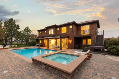 a view of swimming pool with a outdoor seating