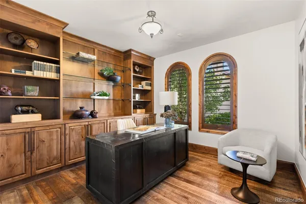a living room with furniture a rug and a large window