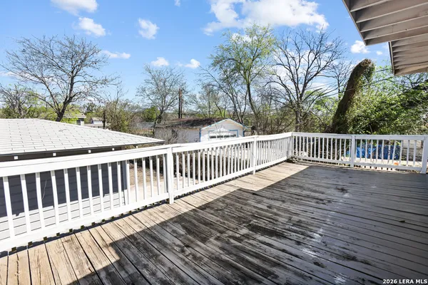a view of deck with wooden floor and fence