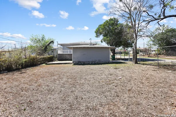 a house view with a backyard space