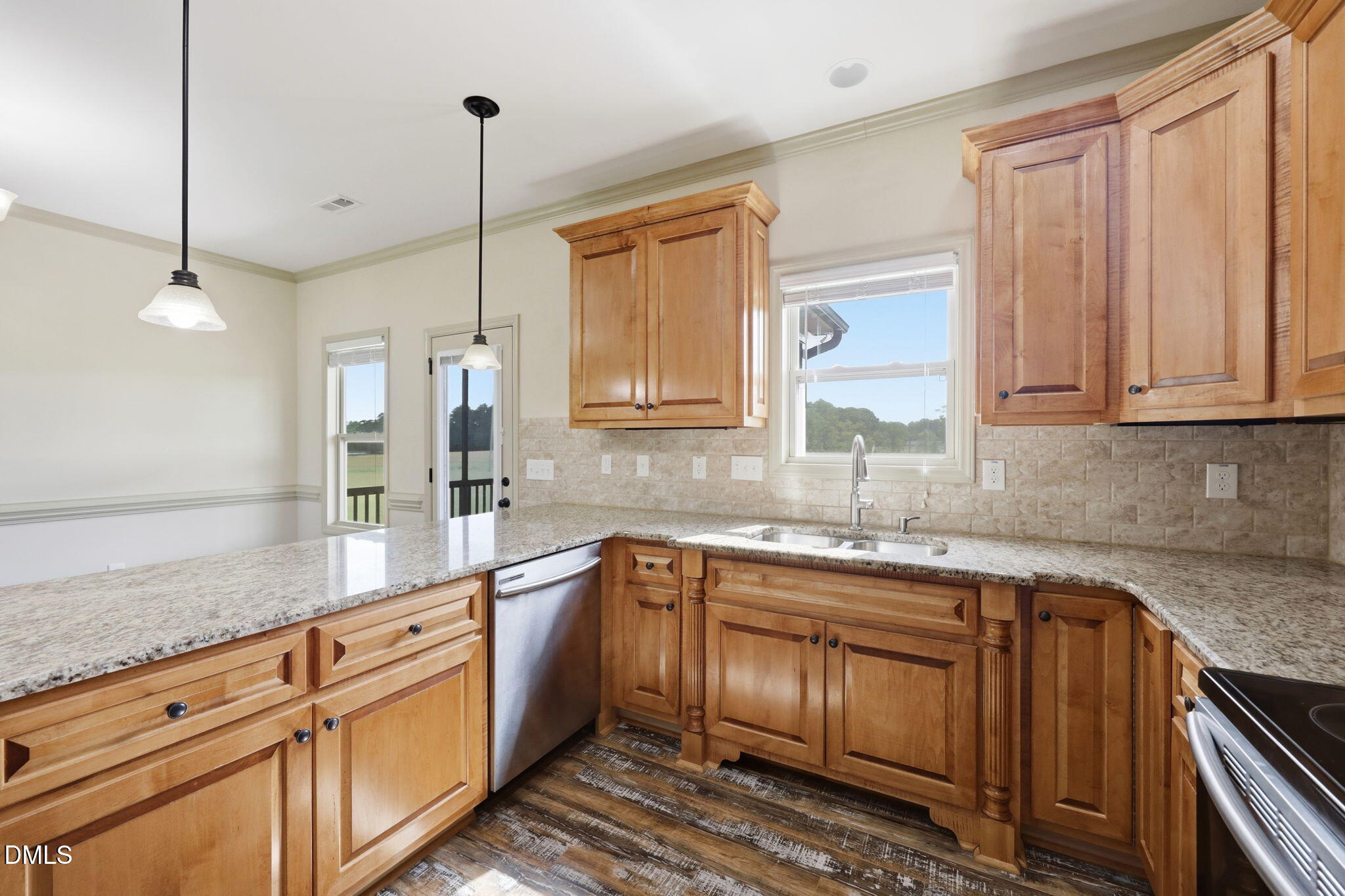 3587 Hannah Creek Road Benson, NC 27504 - Photo 11 of 43 a kitchen with stainless steel appliances granite countertop a sink a stove and cabinets