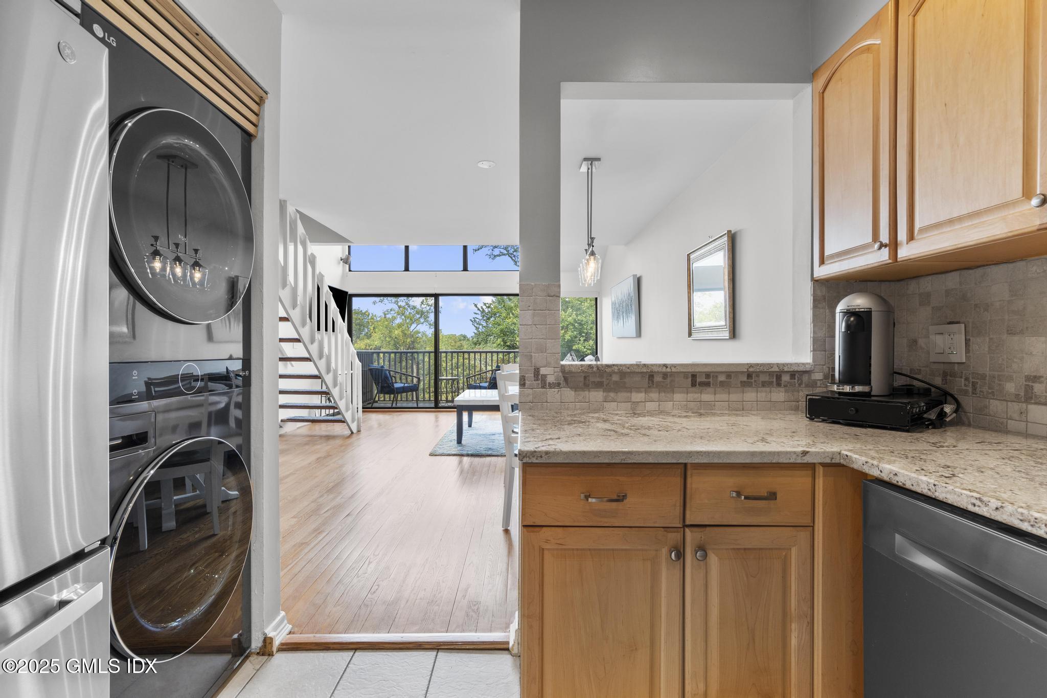 1465 East Putnam Avenue, Unit 421 Riverside, CT 06878 - Photo 11 of 29 a kitchen with a stove a sink and a cabinets