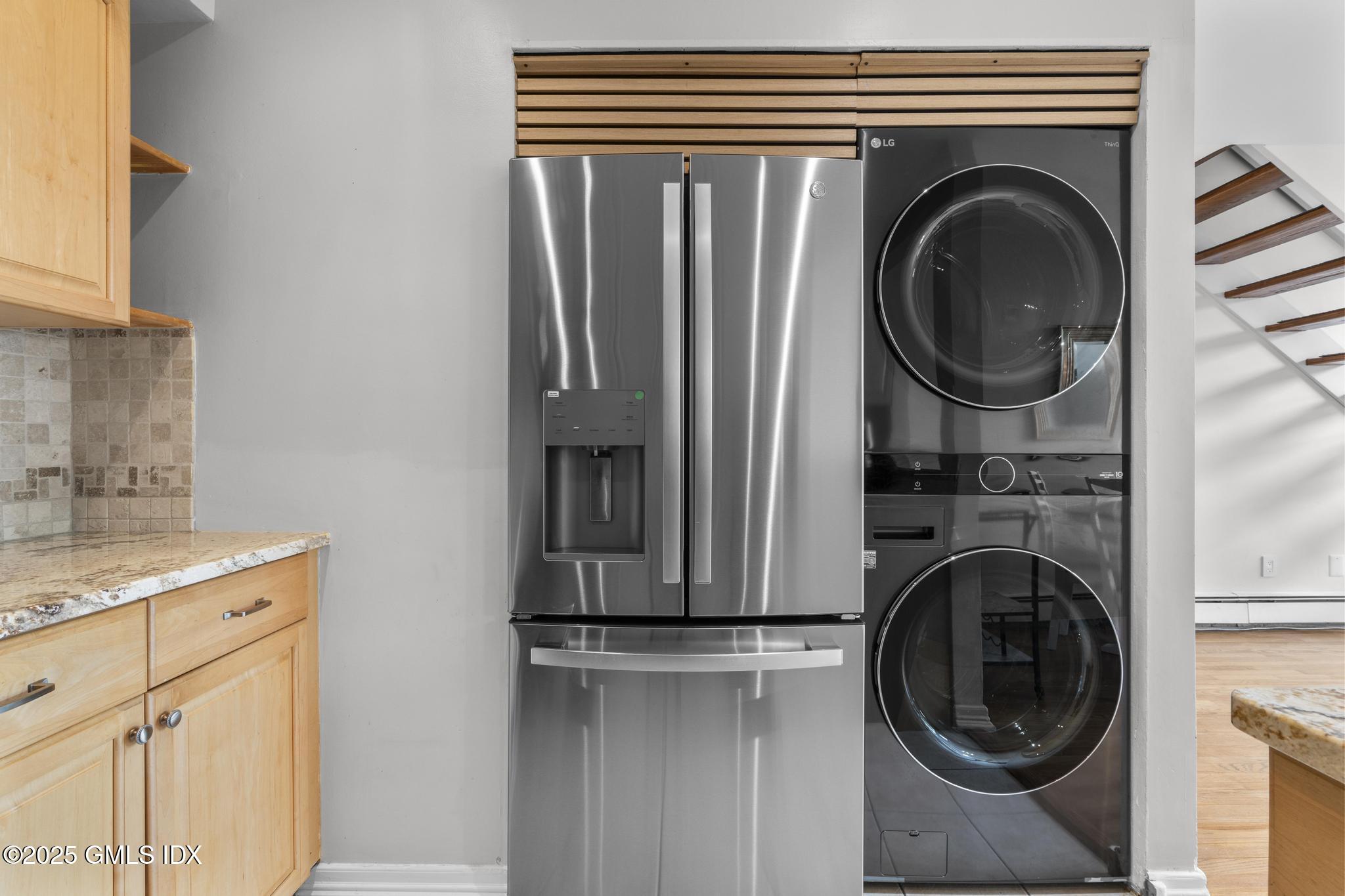 1465 East Putnam Avenue, Unit 421 Riverside, CT 06878 - Photo 12 of 29 a close view of a utility room with dryer and washer