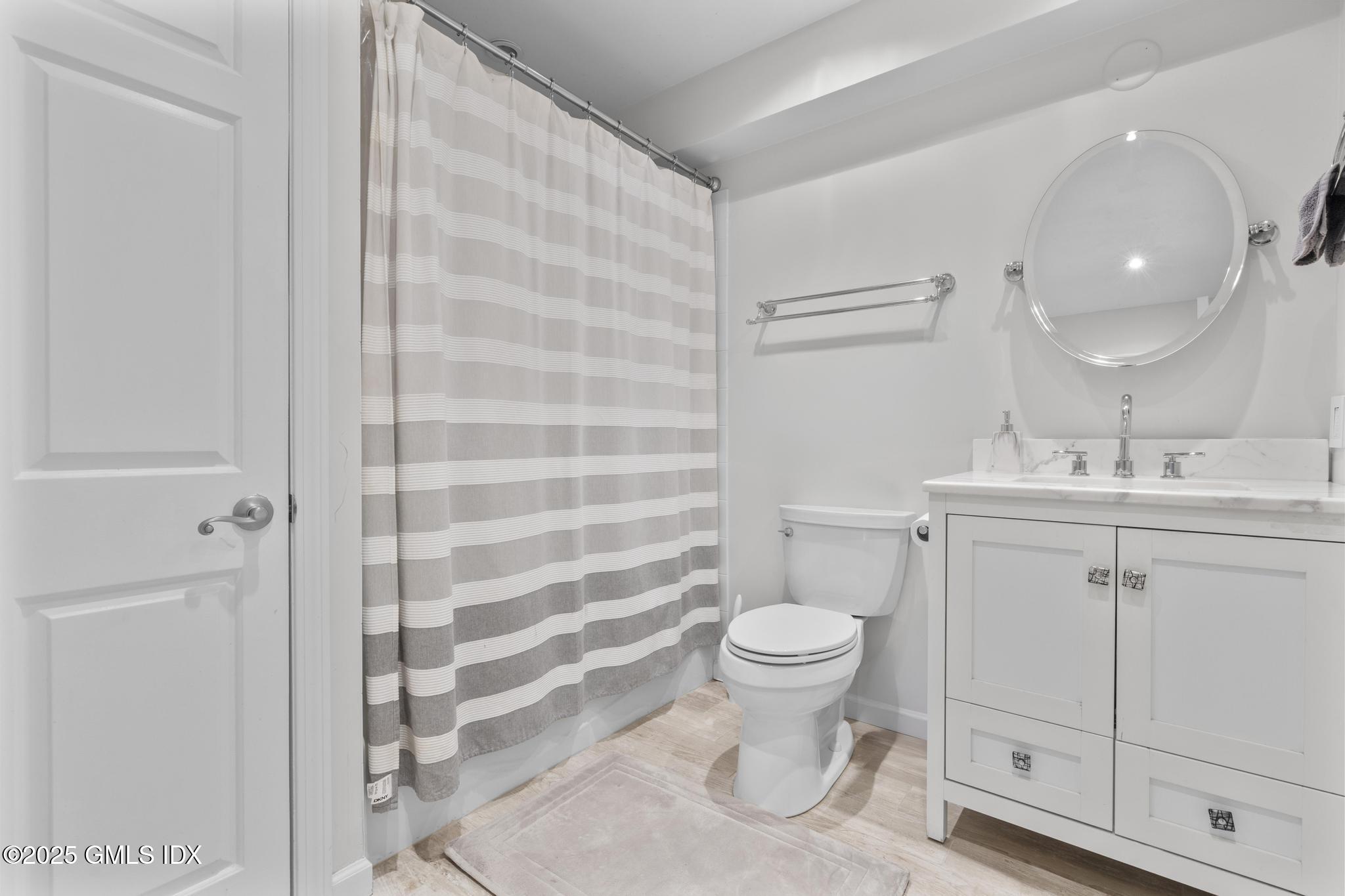 1465 East Putnam Avenue, Unit 421 Riverside, CT 06878 - Photo 18 of 29 a bathroom with a sink toilet and shower