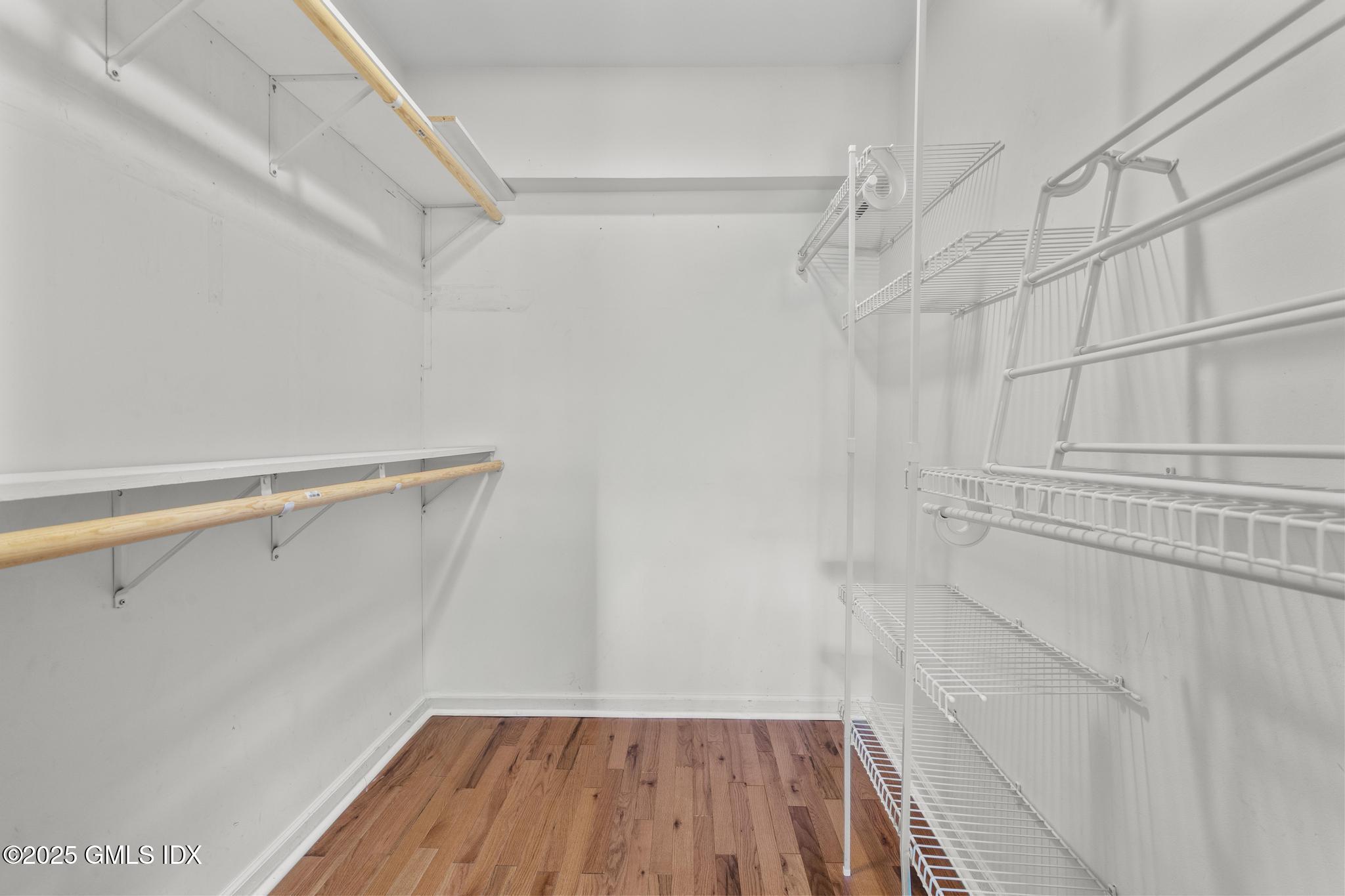 1465 East Putnam Avenue, Unit 421 Riverside, CT 06878 - Photo 19 of 29 a view of walk in closet with empty racks