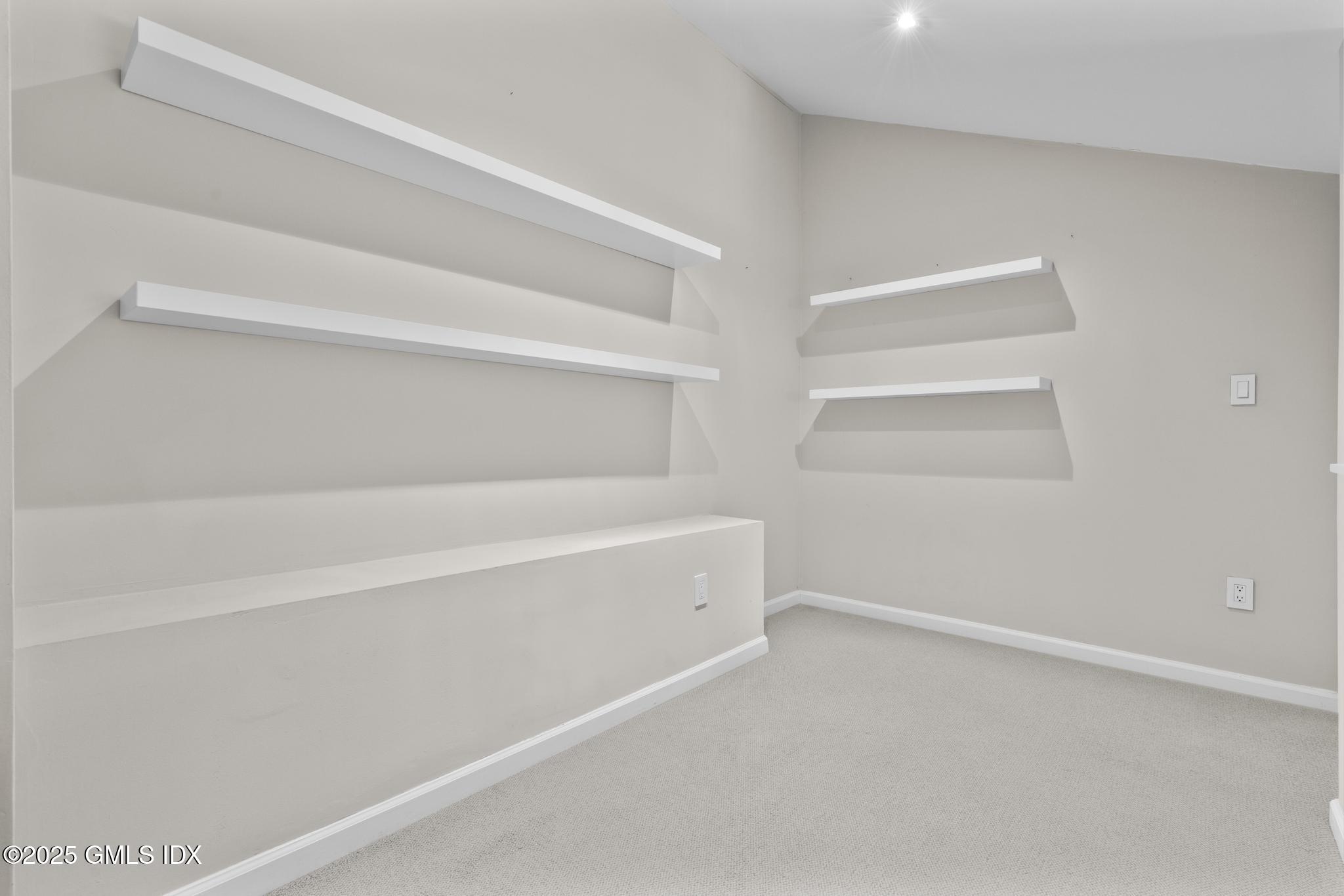 1465 East Putnam Avenue, Unit 421 Riverside, CT 06878 - Photo 20 of 29 a view of an empty walk in closet