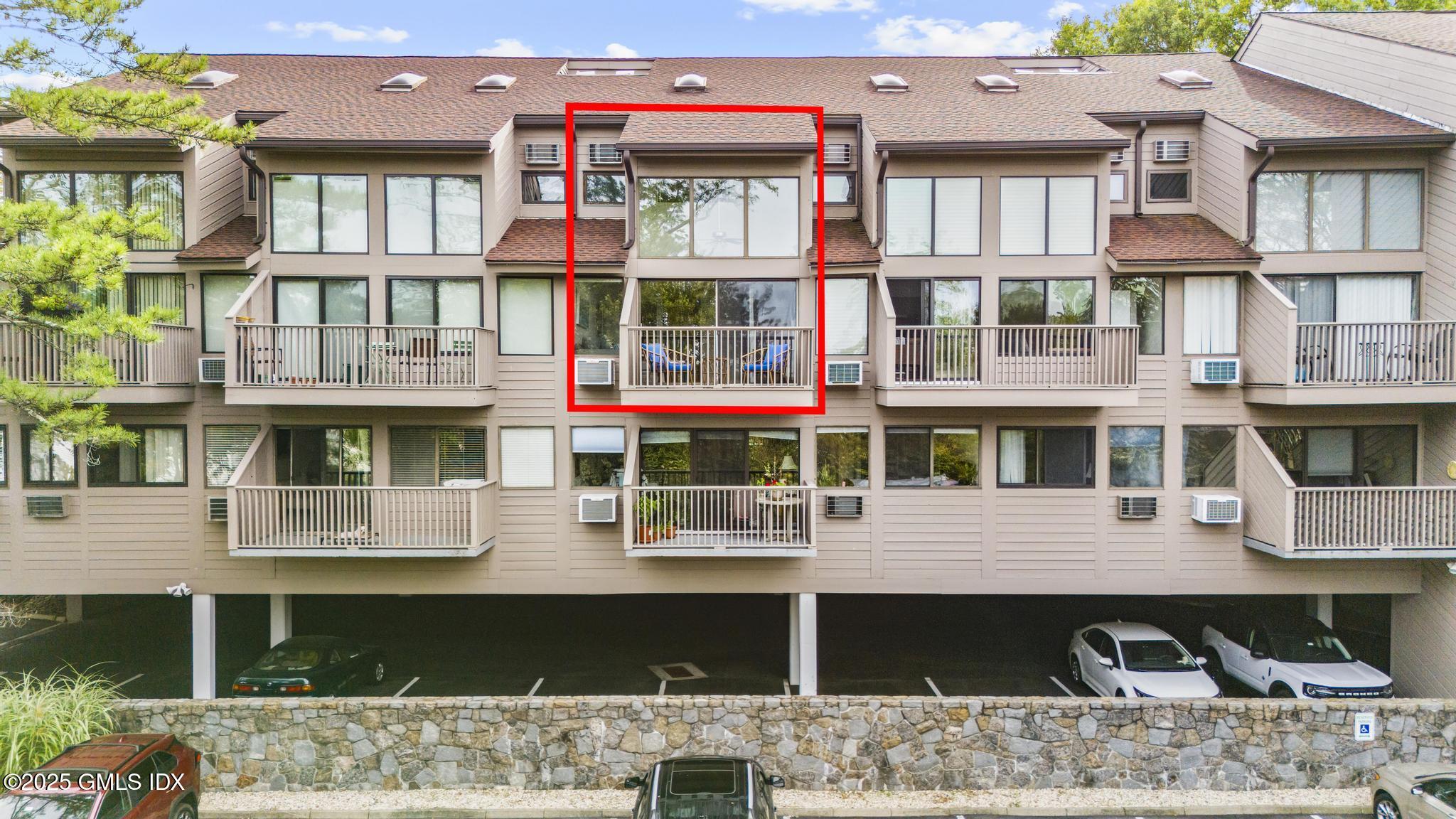 1465 East Putnam Avenue, Unit 421 Riverside, CT 06878 - Photo 22 of 29 a front view of residential houses