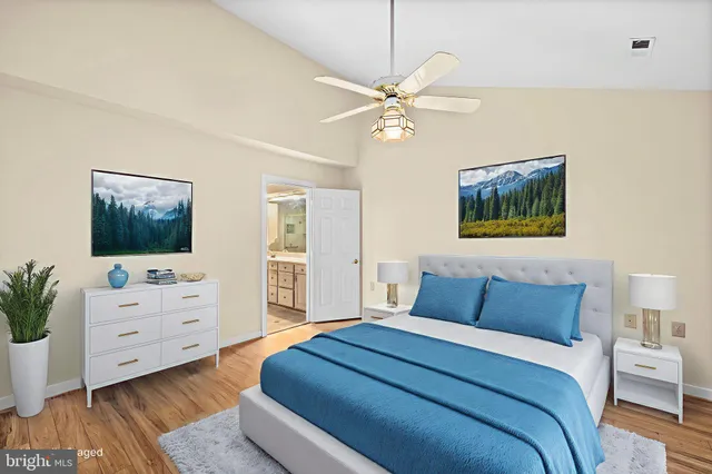 a bedroom with a bed and a dresser