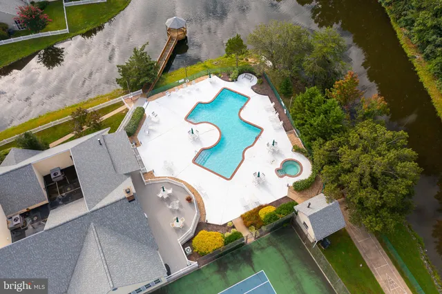 an aerial view of a house with a swimming pool