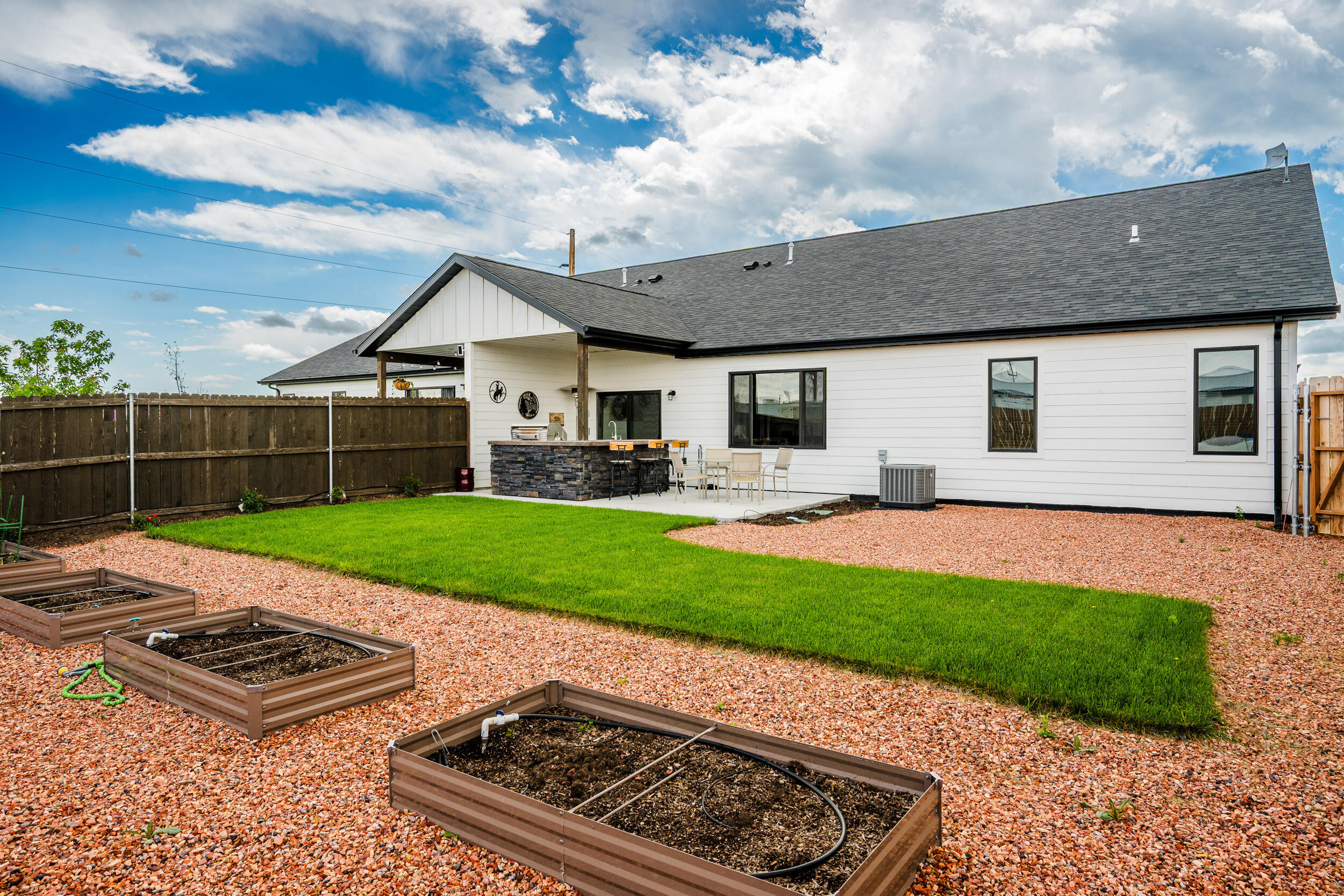 1353 Stoneridge Drive Ranchester, WY 82839 - Photo 2 of 43 backyard,rasised garden beds