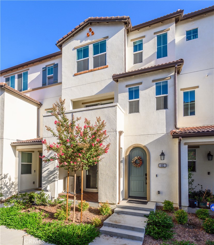 603 Shadowbrook Lake Forest, CA 92610 - Photo 2 of 60 a front view of a house with garden