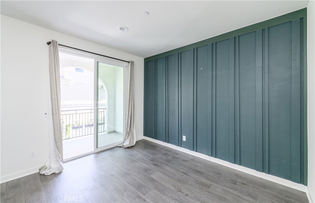603 Shadowbrook Lake Forest, CA 92610 - Photo 23 of 60 an empty room with wooden floor