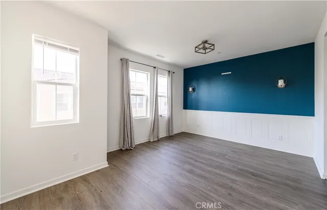 a spacious bathroom with a granite countertop sink and a mirror