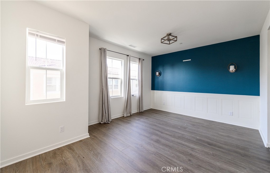 603 Shadowbrook Lake Forest, CA 92610 - Photo 29 of 60 an empty room with wooden floor and windows