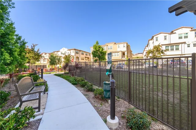 a view of a swimming pool with outdoor seating and a terrace