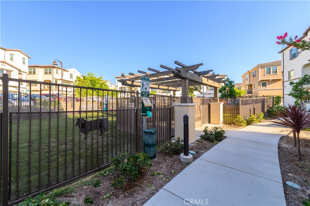 603 Shadowbrook Lake Forest, CA 92610 - Photo 41 of 60 a view of a building with a garden in the background