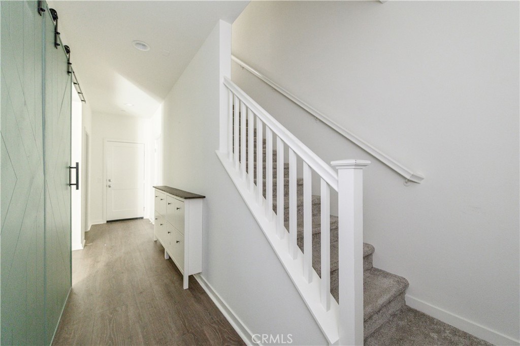 603 Shadowbrook Lake Forest, CA 92610 - Photo 5 of 60 a view of a hallway with wooden floor and entryway