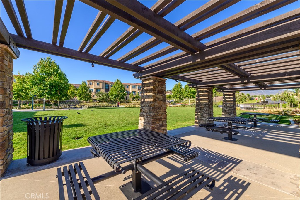 603 Shadowbrook Lake Forest, CA 92610 - Photo 55 of 60 a view of a patio with a table chairs and a backyard