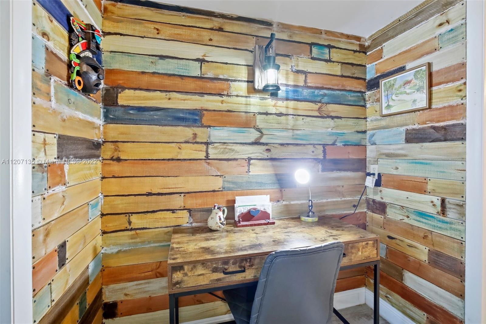 334 Pine Ridge Circle, Unit A2 Greenacres, FL 33463 - Photo 15 of 16 a room with a table and chairs