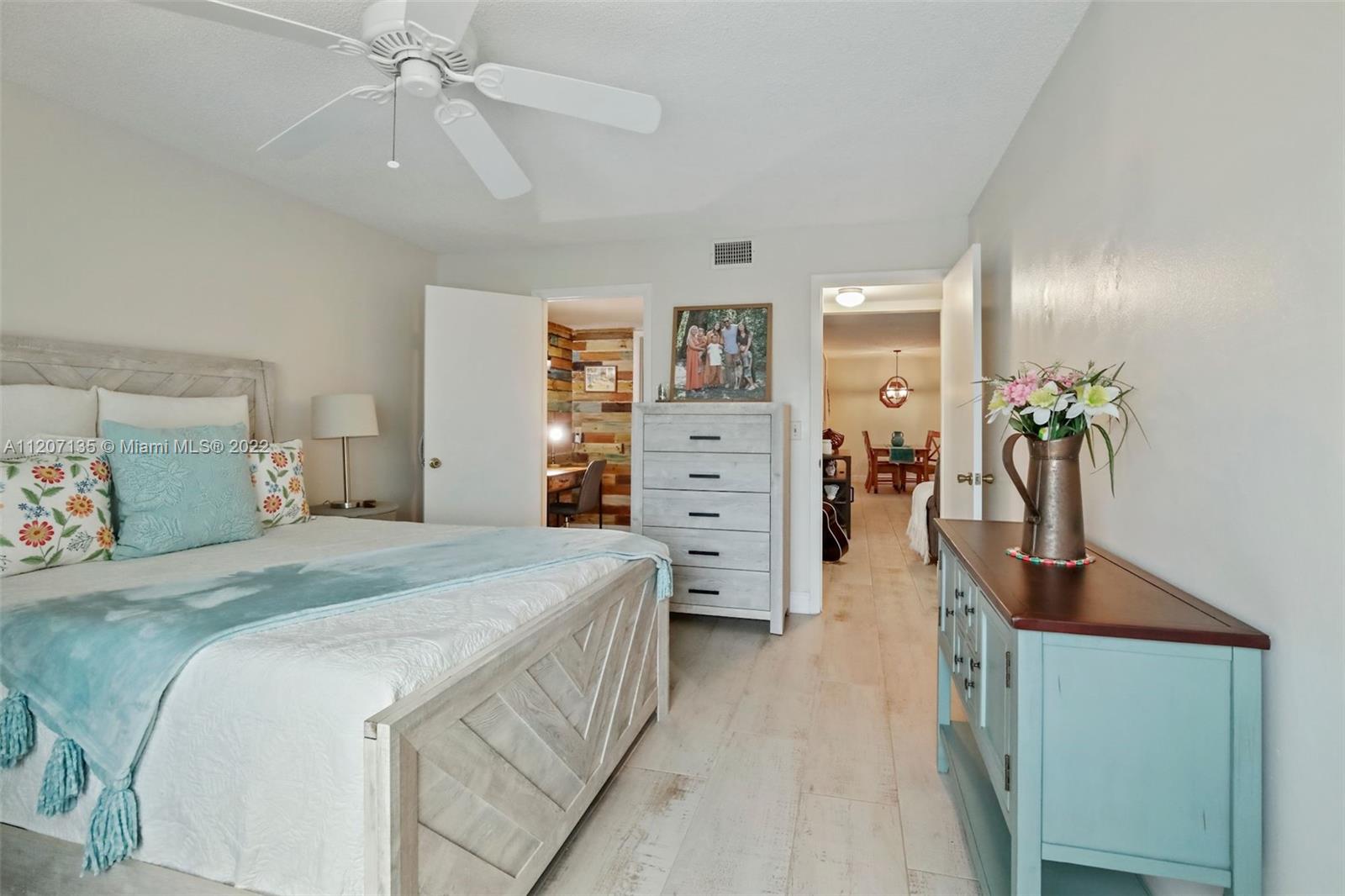 334 Pine Ridge Circle, Unit A2 Greenacres, FL 33463 - Photo 4 of 16 a bedroom with a bed and closet