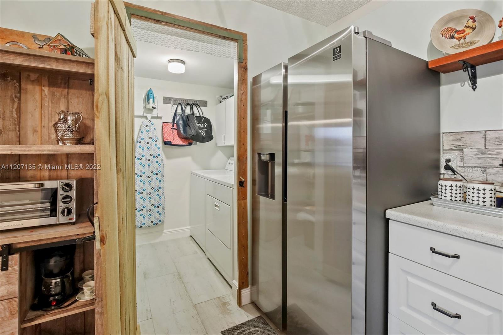 334 Pine Ridge Circle, Unit A2 Greenacres, FL 33463 - Photo 9 of 16 a bathroom with a shower and a sink mirror
