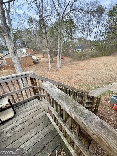 117 Appleton Boulevard Stockbridge, GA 30281 - Photo 13 of 13 a view of a balcony with wooden floor and fence