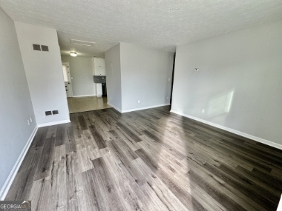 117 Appleton Boulevard Stockbridge, GA 30281 - Photo 3 of 13 a view of a room with wooden floor and a sink